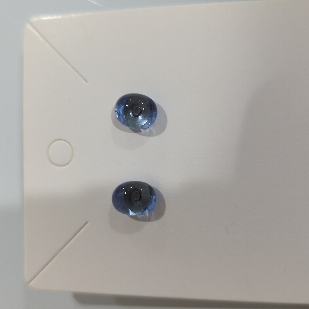 - Artisan Handmade light blue  transparent glass gold studs. 3/4cm in size.